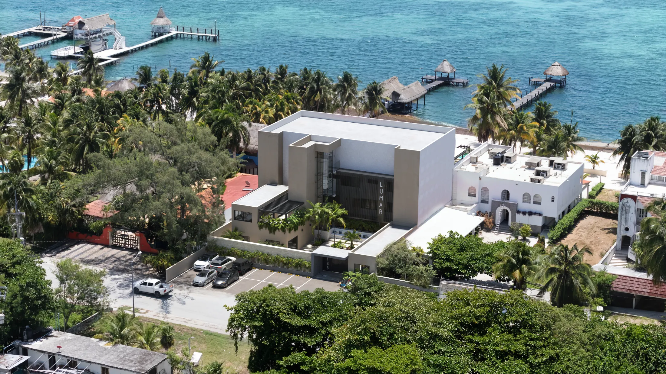 Aerial view of the arrival side of LUMAR, with the road and Caribbean coastline nearby