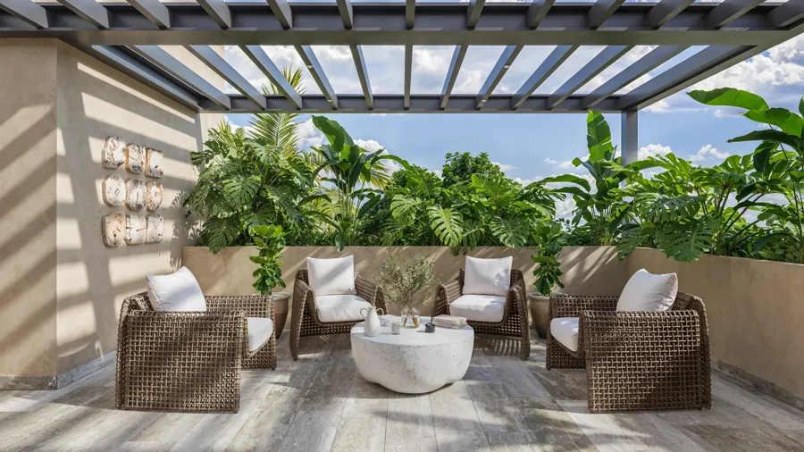 Shaded reading terrace surrounded by tropical landscaping