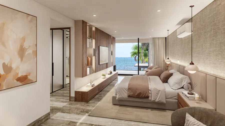 Primary bedroom opening onto a terrace with a view of the sea