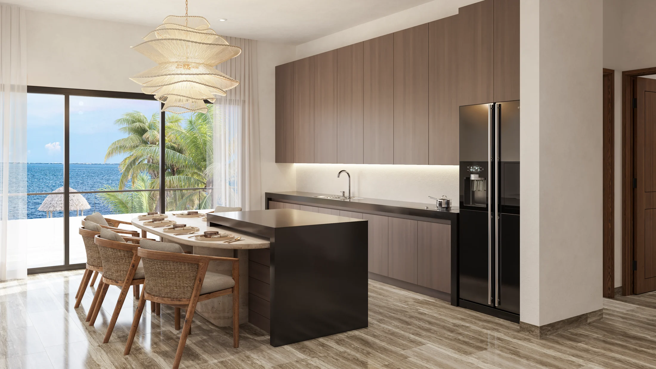 Villa kitchen and dining space with floor-to-ceiling windows facing the Caribbean